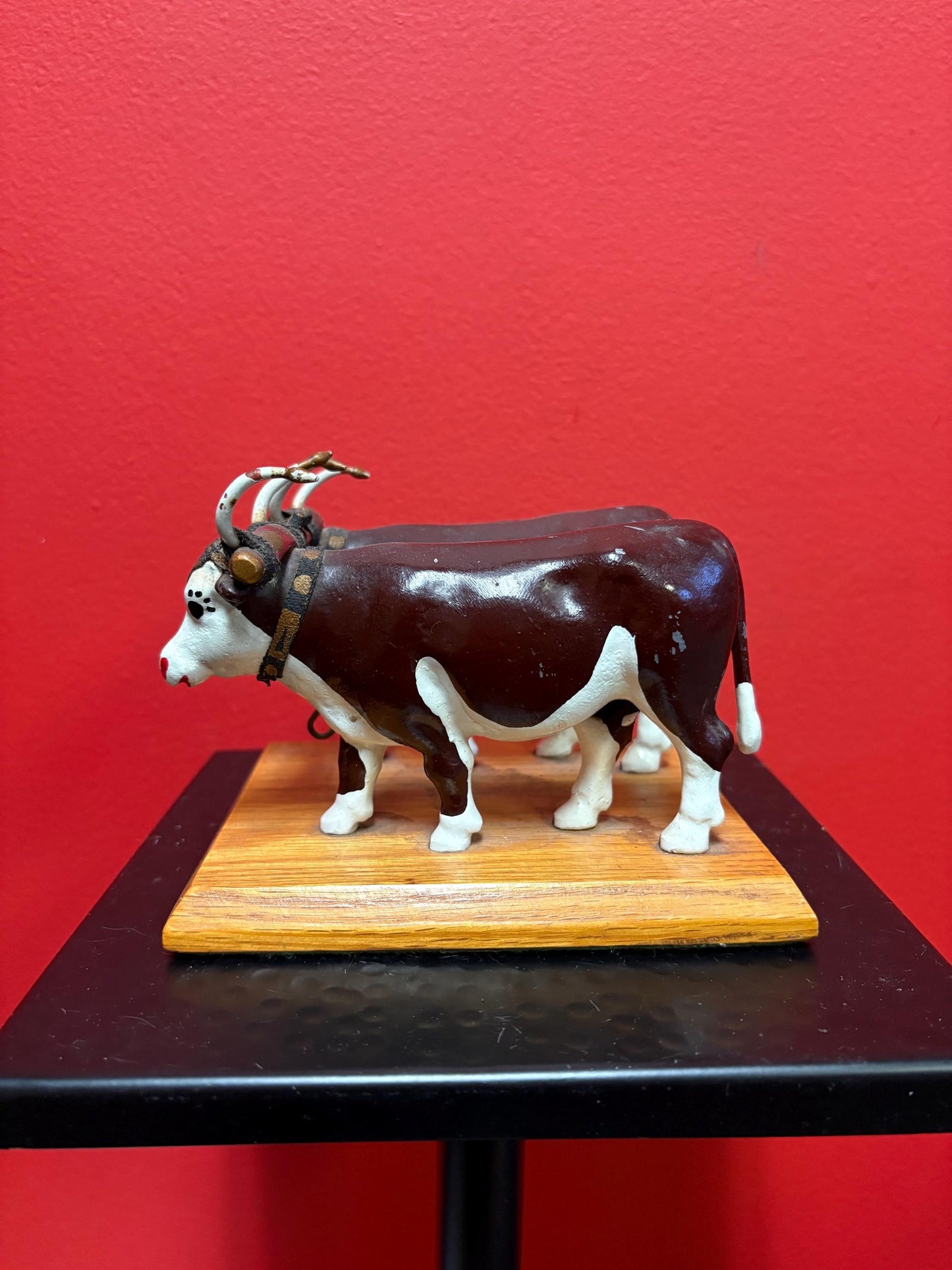 Lovely antique heavy cast metal painted bulls on stand very cool  6 x 4 high  cowboy rancher heaven piece  say what!!