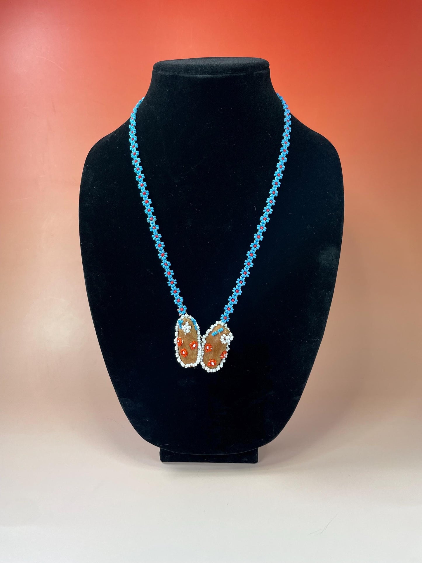 Beautiful approximately 22 inch long, indigenous first nations pacific northwest coast beaded necklace with tiny moccasins  great condition