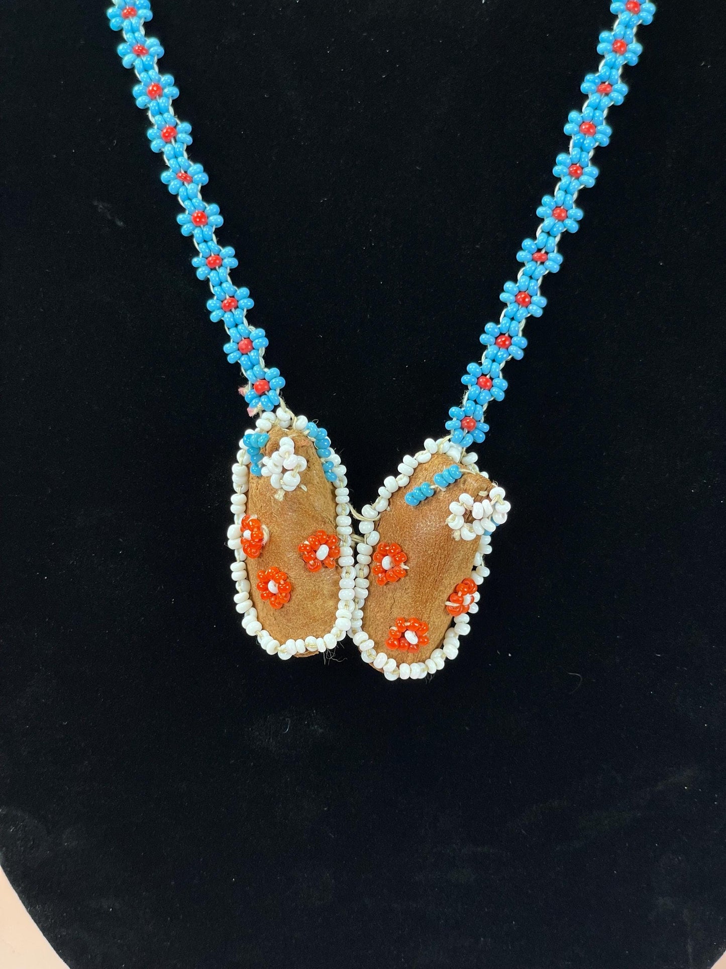 Beautiful approximately 22 inch long, indigenous first nations pacific northwest coast beaded necklace with tiny moccasins  great condition