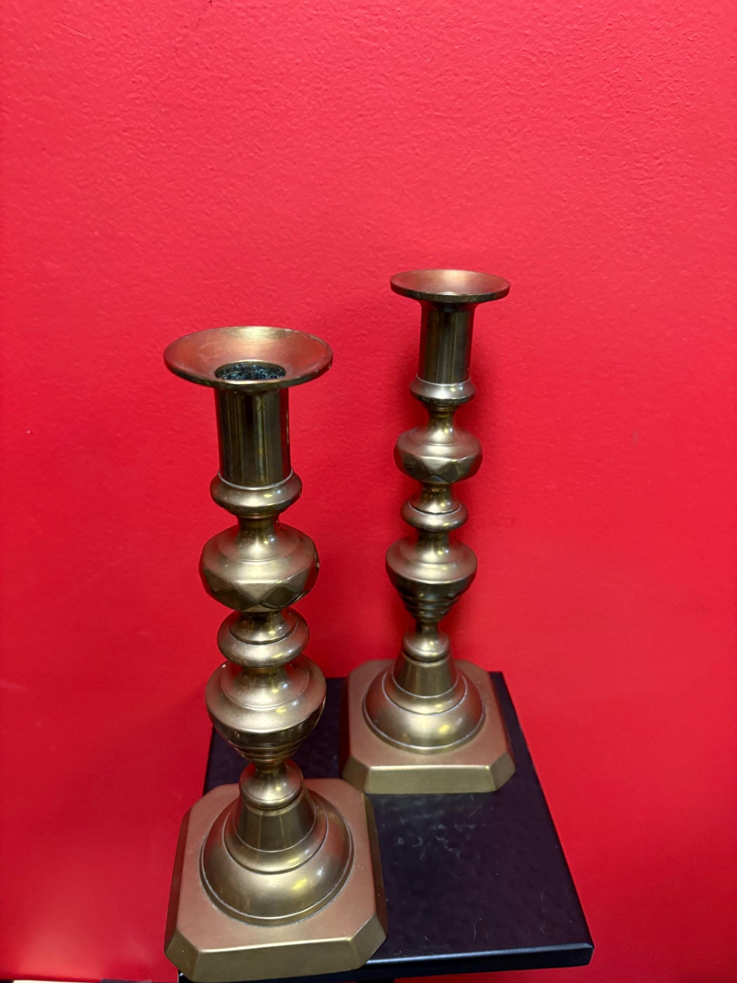 Beautiful 11 inch tall antique brass candlesticks with the original lifters  good condition and stable