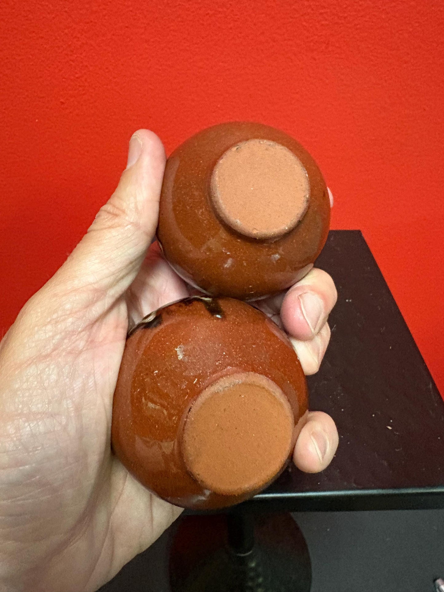 Lovely pair of 2 1/2 inch high South American terra-cotta painted pots  one chipped and one perfect  great value