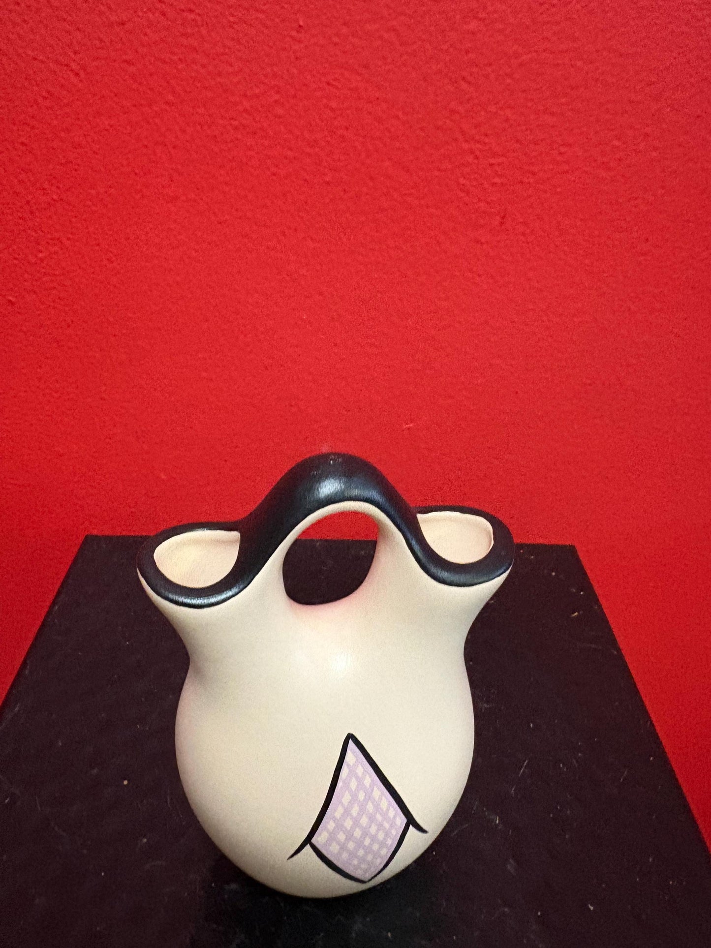 Lovely 4 1/2 inch tall signed Navajo pottery vase  great colour and shape