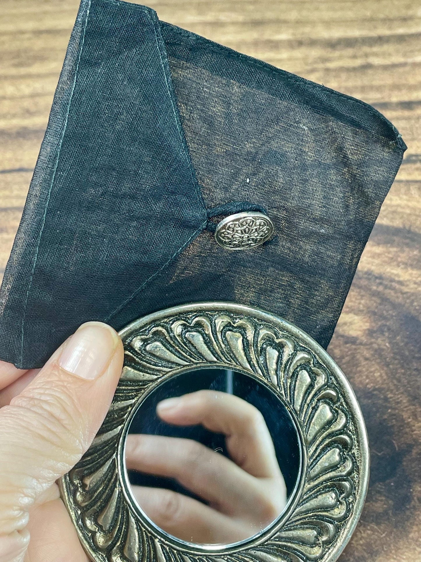 Small Pocket Mirror with Ornate Design