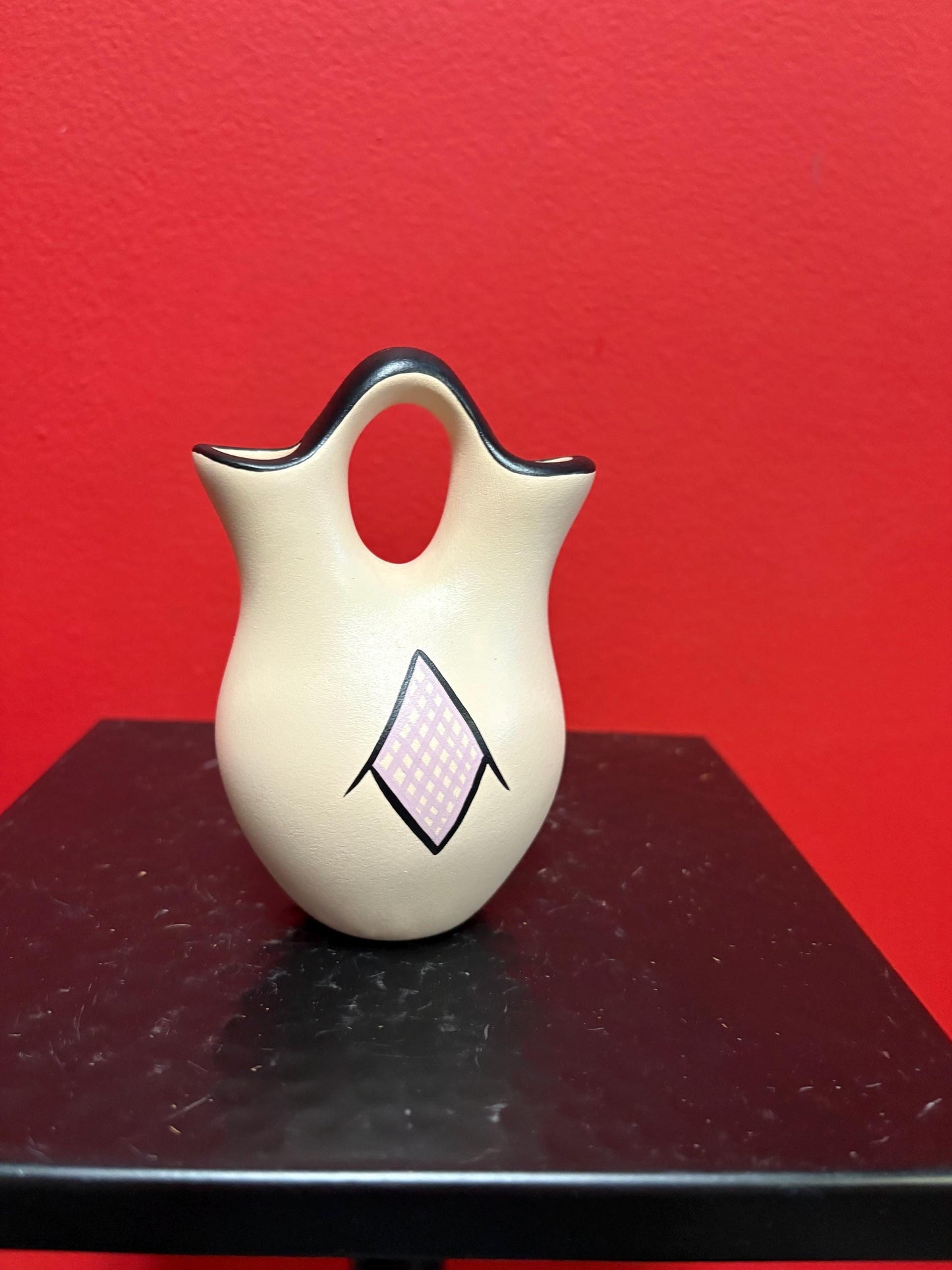 Lovely 4 1/2 inch tall signed Navajo pottery vase  great colour and shape