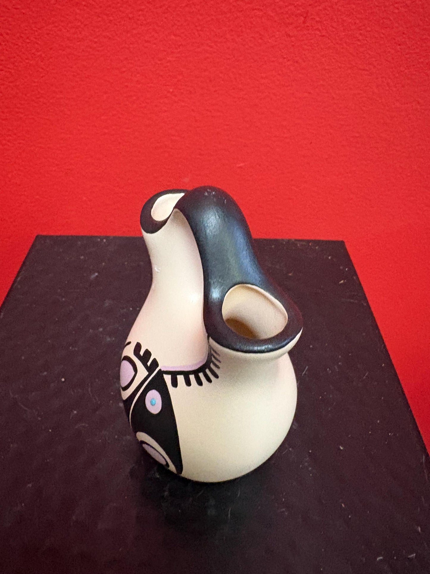 Lovely 4 1/2 inch tall signed Navajo pottery vase  great colour and shape