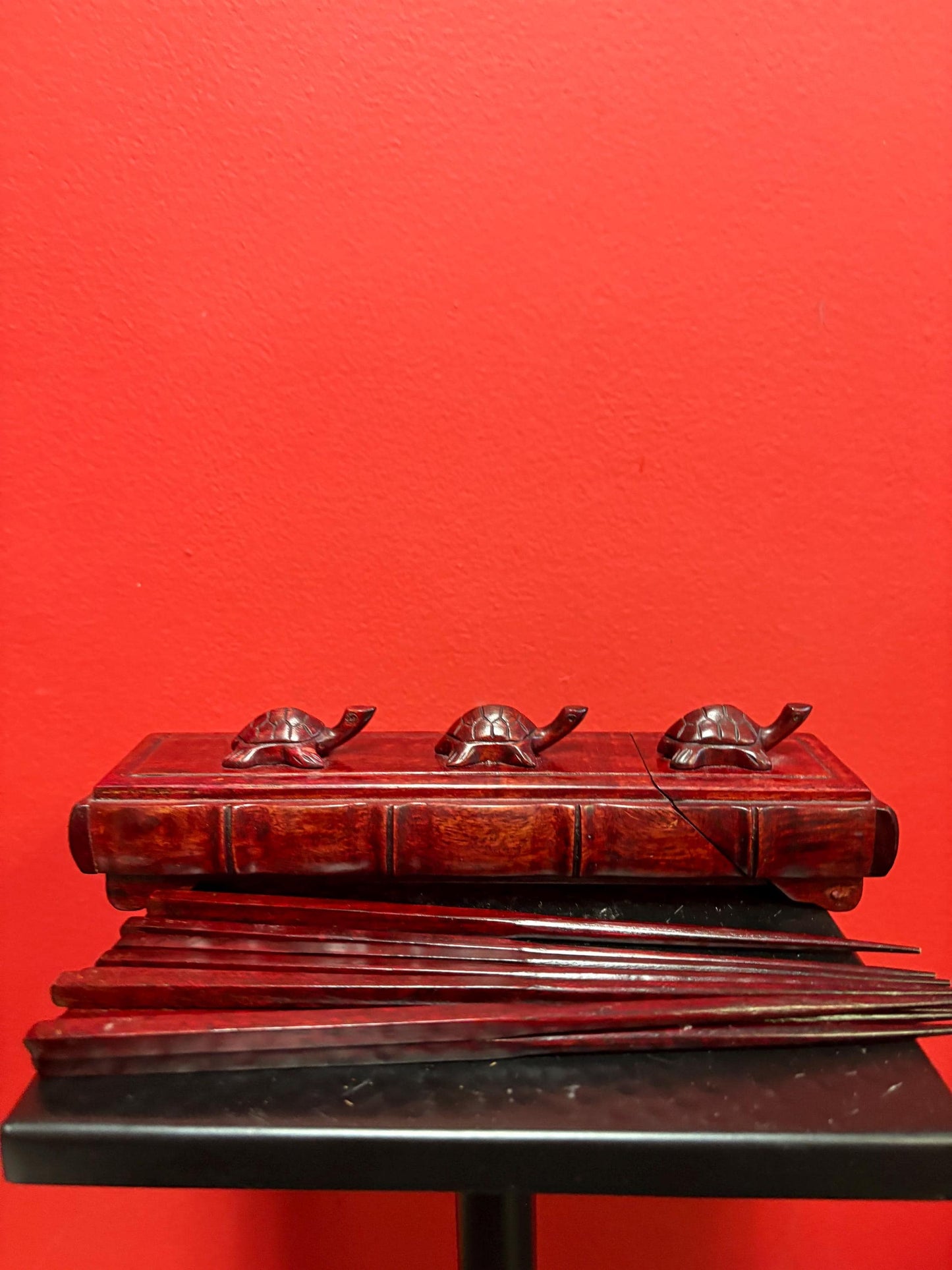Lovely Asian Rosewood chopstick box with turtles on top  9 inches long  comes with five sets of chopsticks  wonderful gift