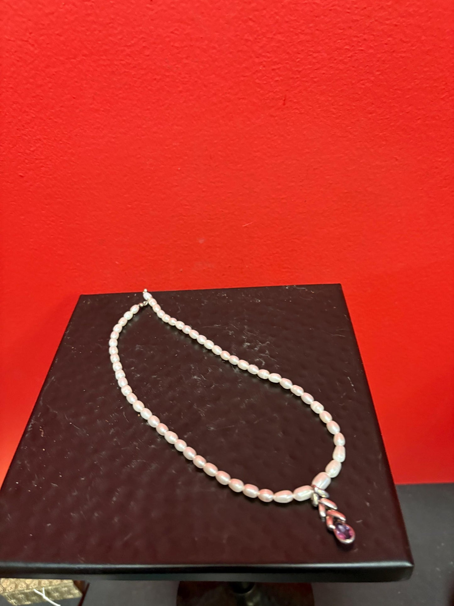 Beautiful approximately 15 inch long freshwater pearl necklace - with silver and amethyst charm unusual and wonderful price