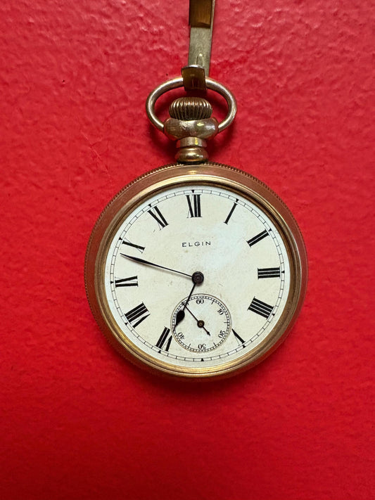 Lovely Gold filled  3 inch Elgin pocket watch with no glass  you fix it you open it  as is  great deal