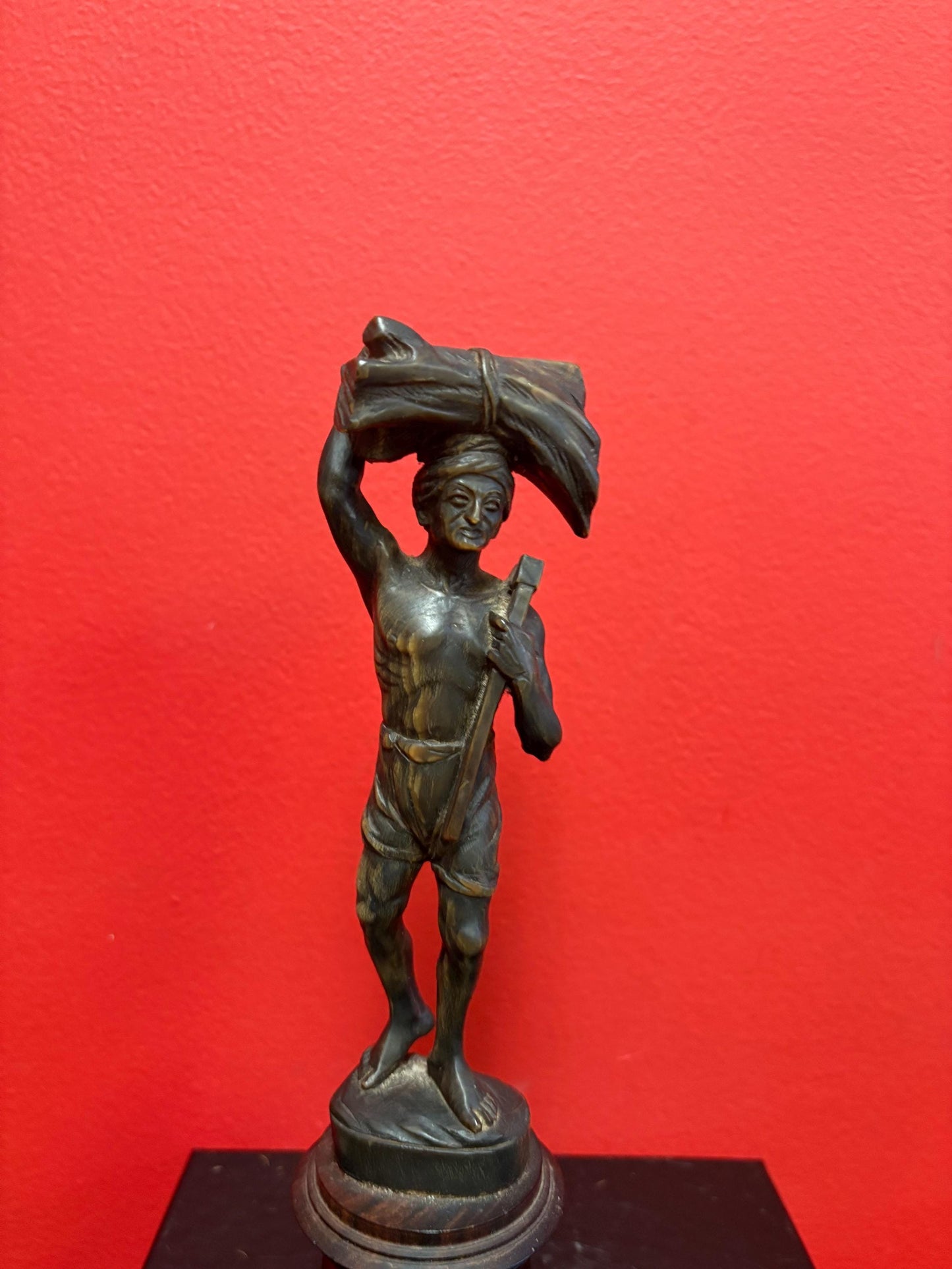 Stunning antique oceanic hand carved horn statue of a warrior on wooden plinth  10 inches high  mint condition