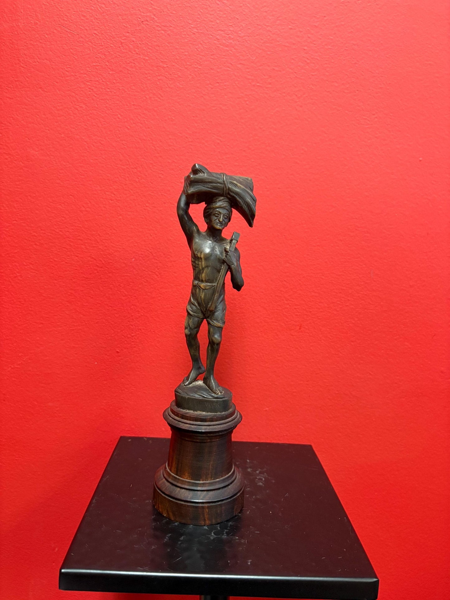 Stunning antique oceanic hand carved horn statue of a warrior on wooden plinth  10 inches high  mint condition