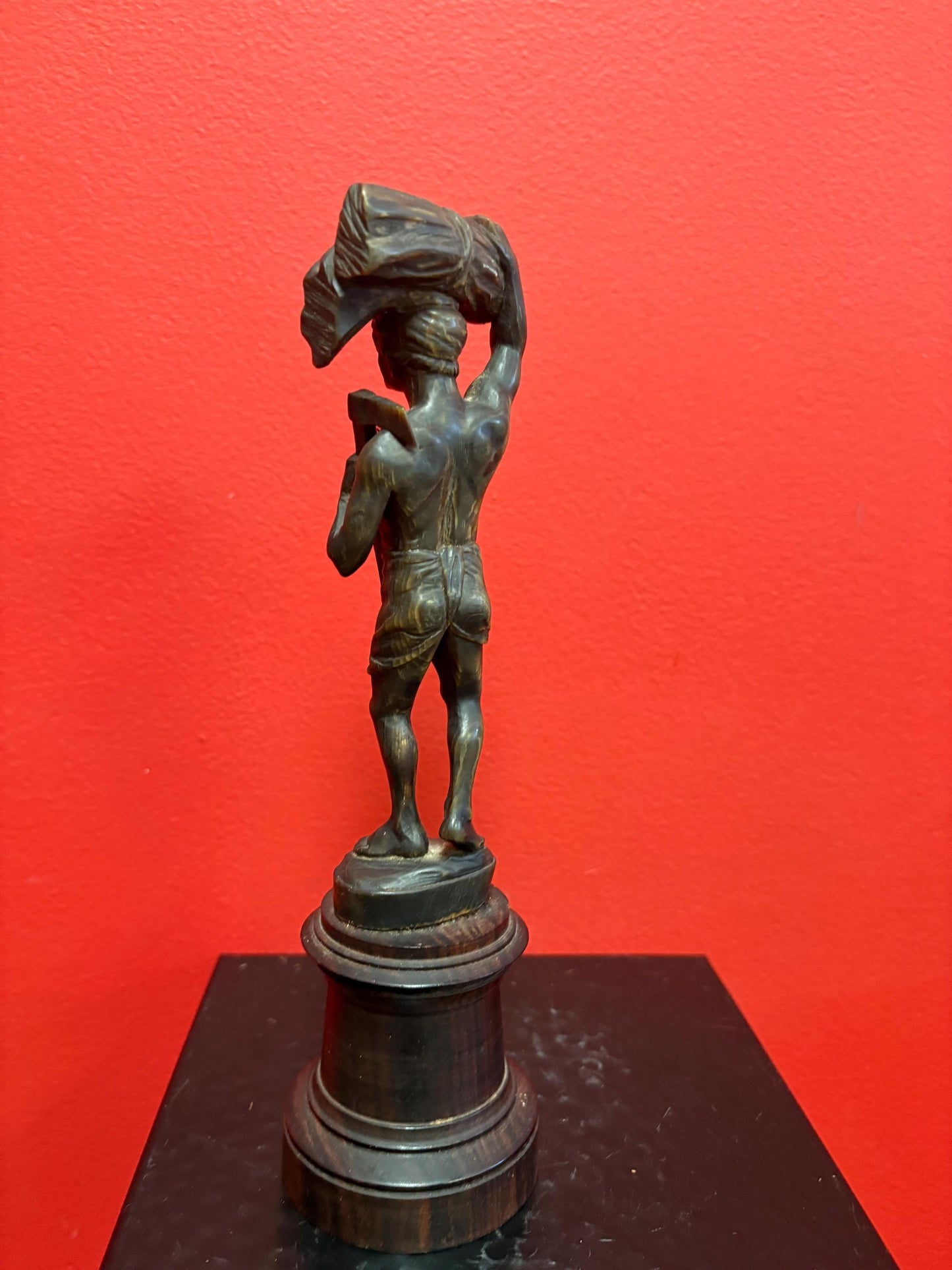 Stunning antique oceanic hand carved horn statue of a warrior on wooden plinth  10 inches high  mint condition