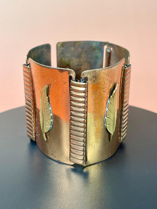 Wide Metal Link Bracelet with Feather Imagery  so cool
