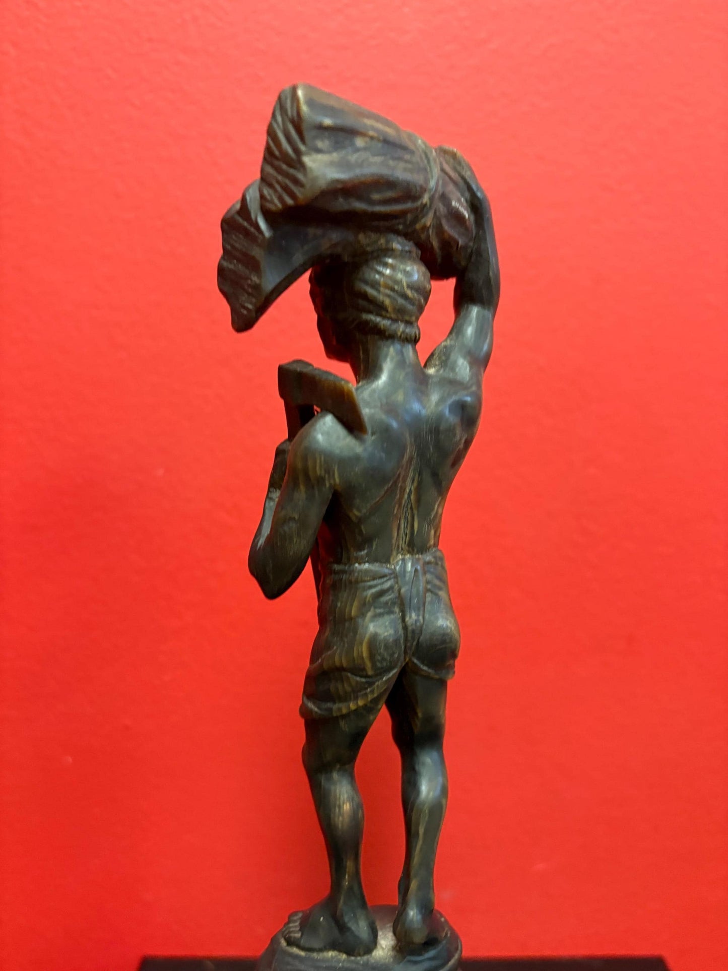 Stunning antique oceanic hand carved horn statue of a warrior on wooden plinth  10 inches high  mint condition