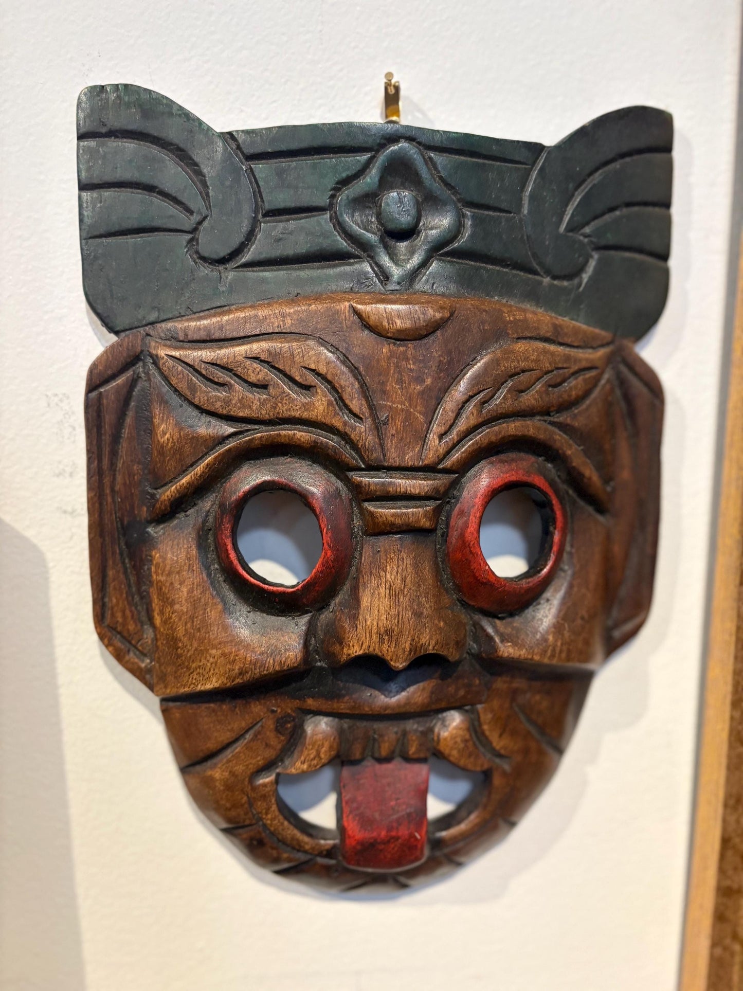 Beautiful older Asian hardwood mask with cheeky tongue ready to hang or gift  10 x 8 inches across  good value