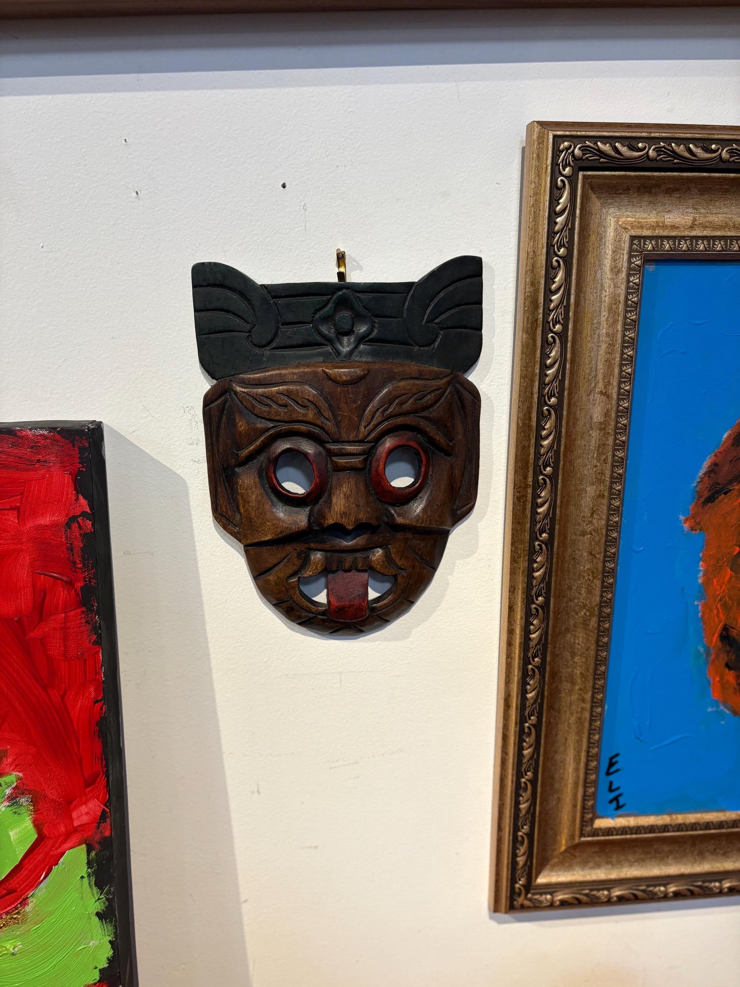 Beautiful older Asian hardwood mask with cheeky tongue ready to hang or gift  10 x 8 inches across  good value