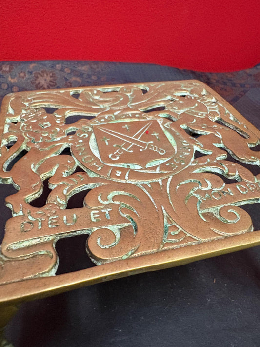 Lovely antique brass royalty themed trivet 6 x 3“ high in great condition with amazing patina
