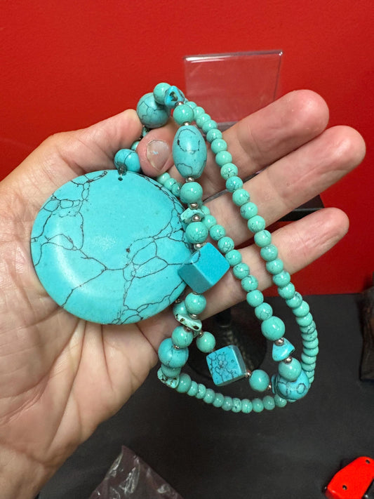 Beautiful turquoise necklace approximately 26 inches long with a 3 inch pendant great value