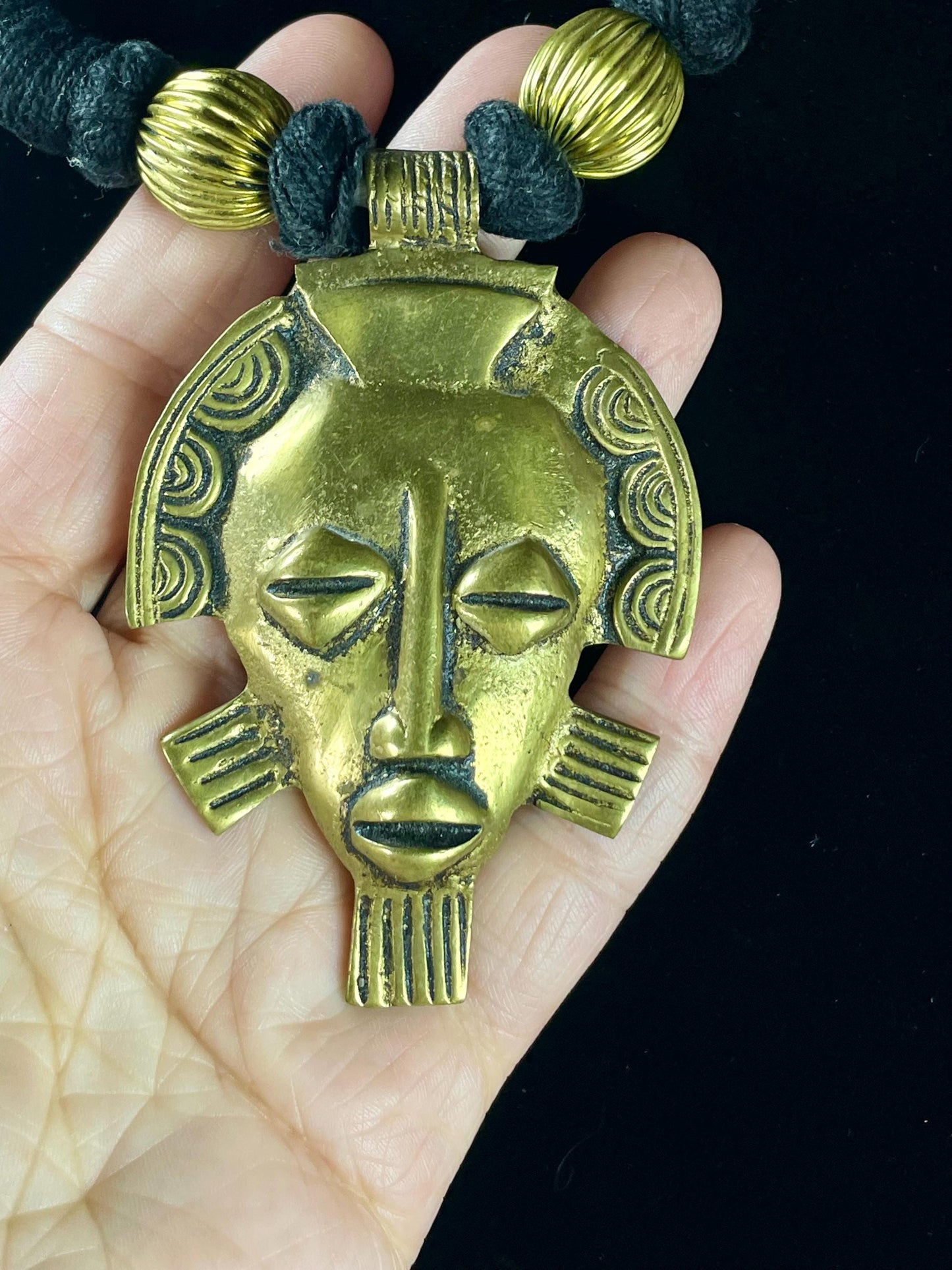 Brass Face Pendant Necklace on Wrapped Cord  16