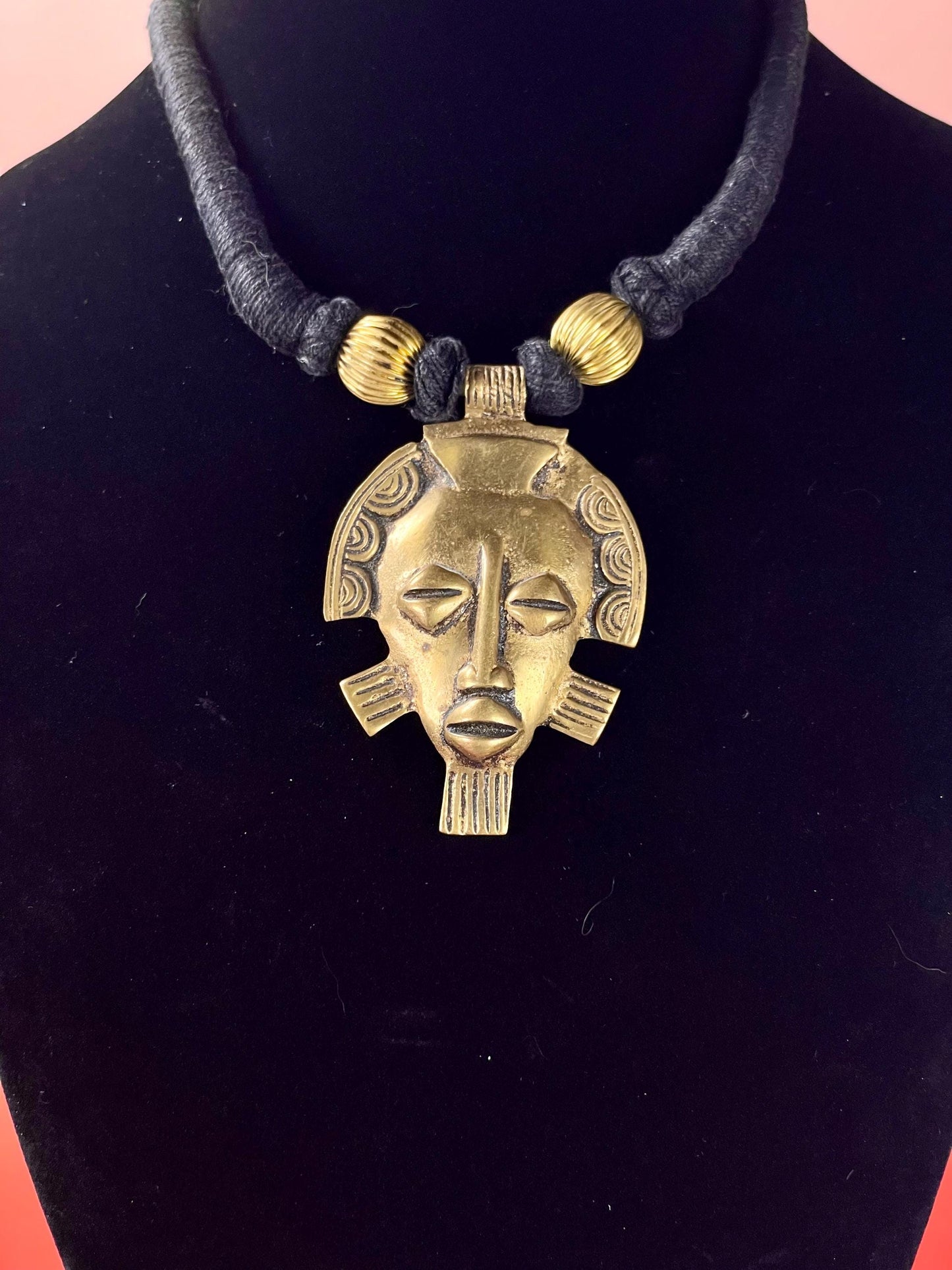 Brass Face Pendant Necklace on Wrapped Cord  16