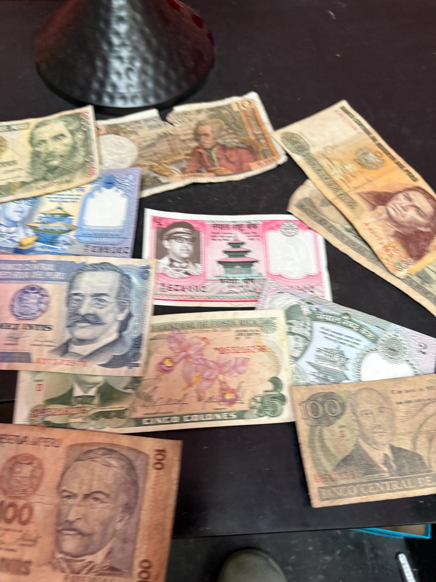 Pile of vintage international bank notes   get rich quick