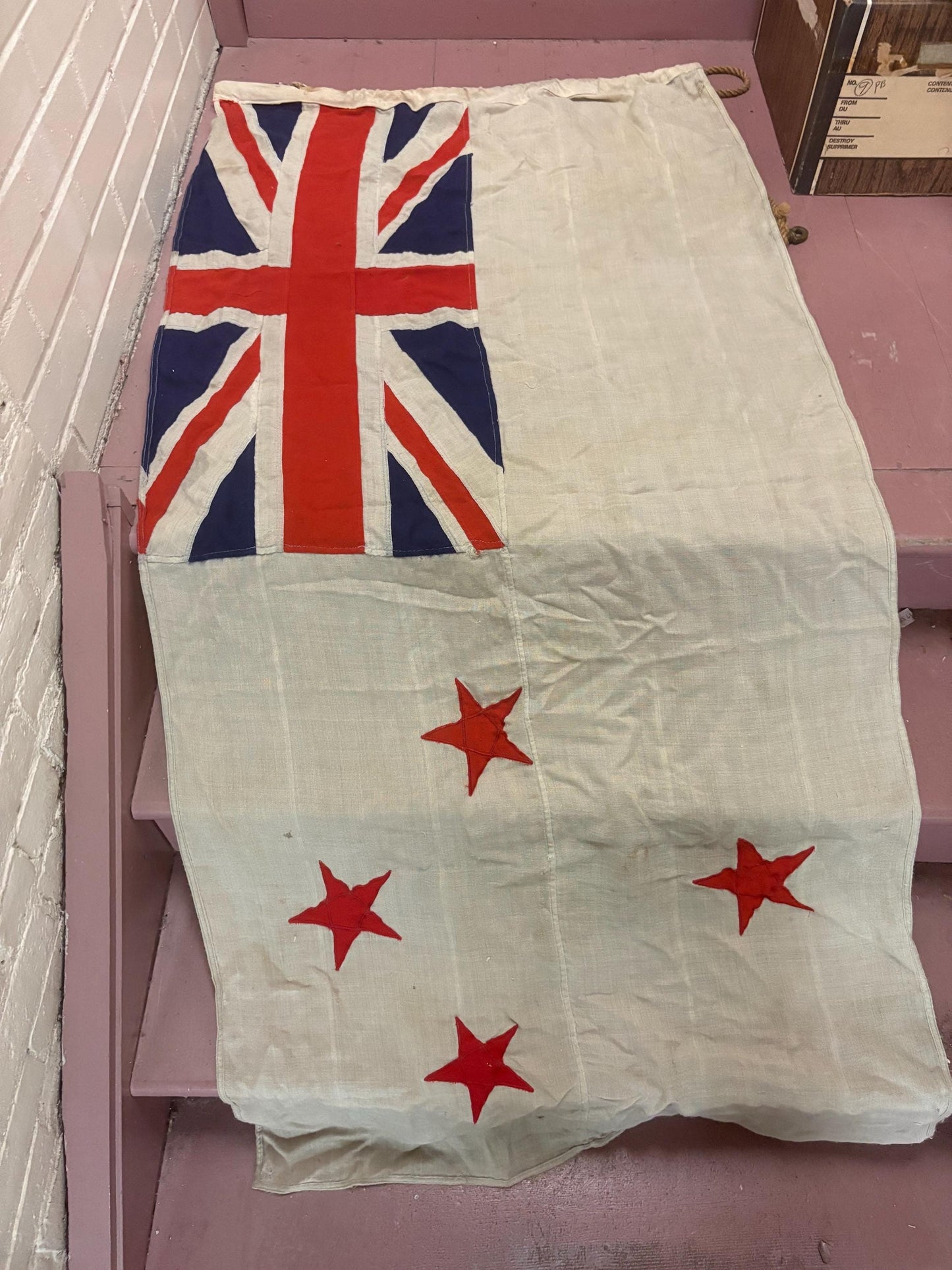 Stunning antique approximately 62 x 30 inch New Zealand flag with hardware  pretty good condition but see photos  great value