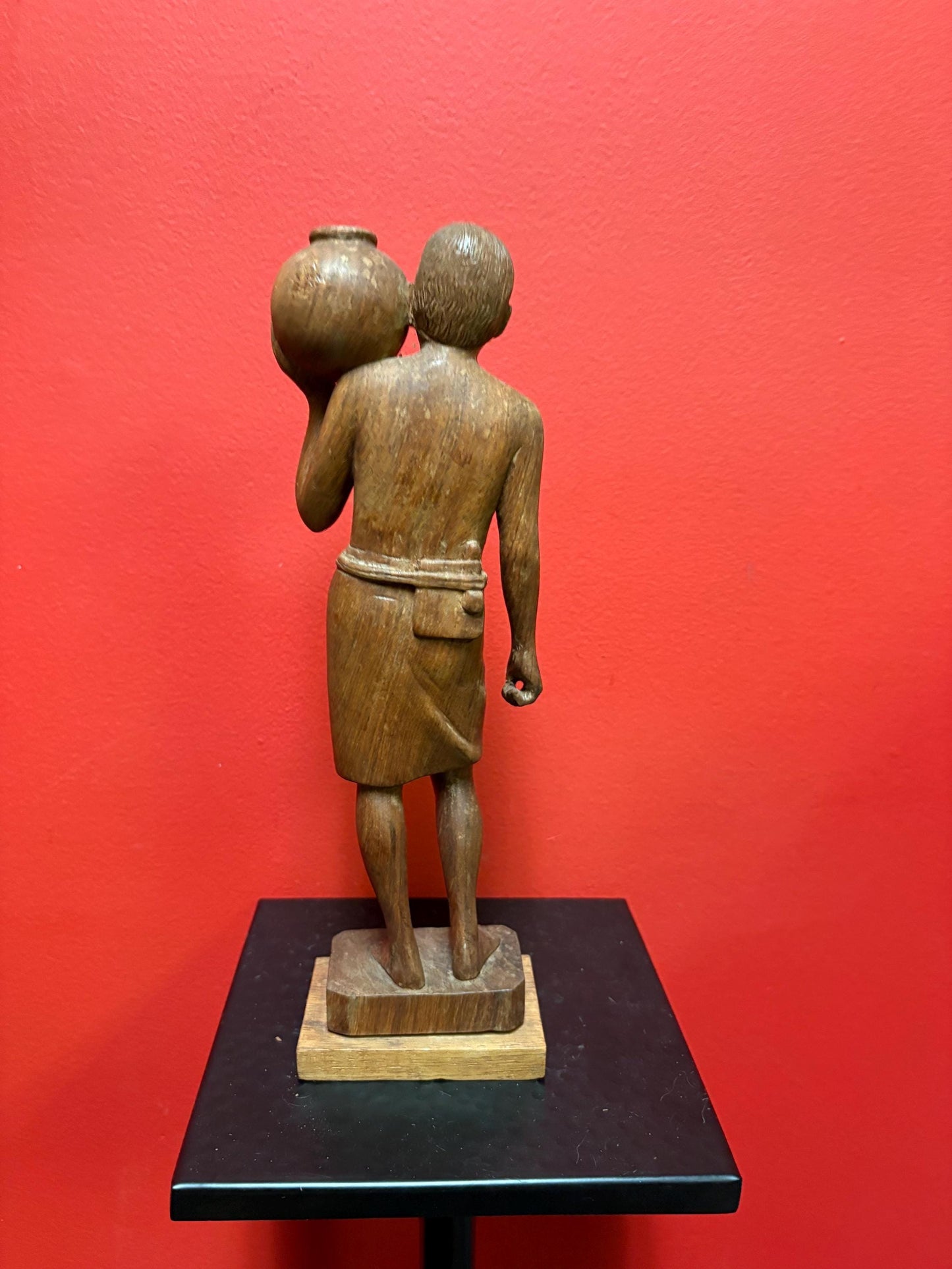 Beautiful wooden signed 1963 Indian statue of a man holding a pot  great detail and fabulous imagery