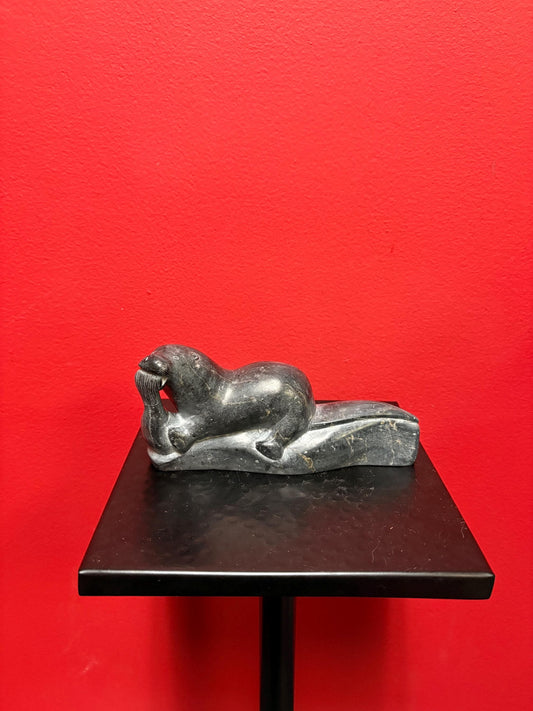 Beautiful old soapstone seal on log with fish in Mouth   7 inches long signed in good condition indigenous Inuit