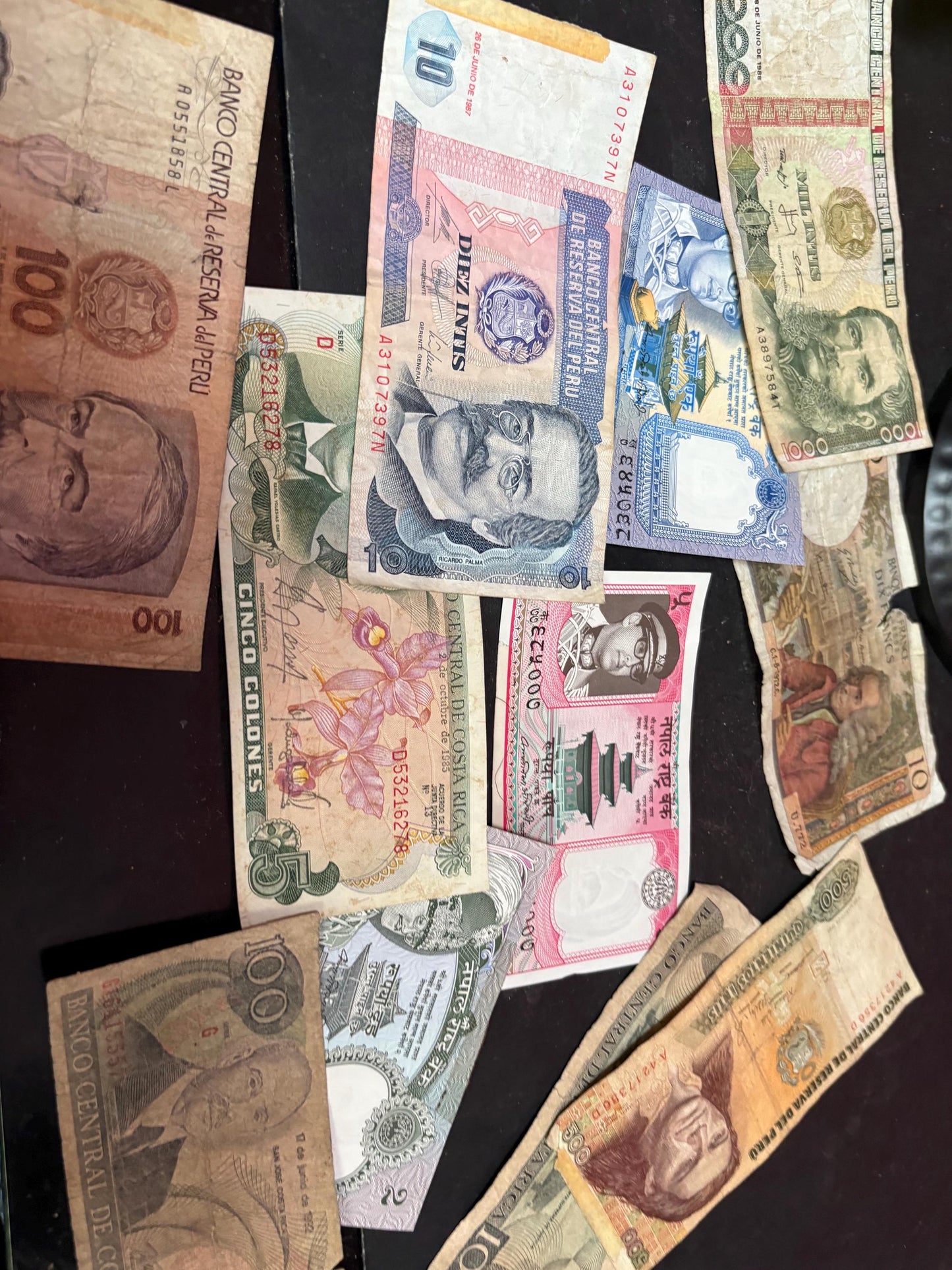 Pile of vintage international bank notes   get rich quick