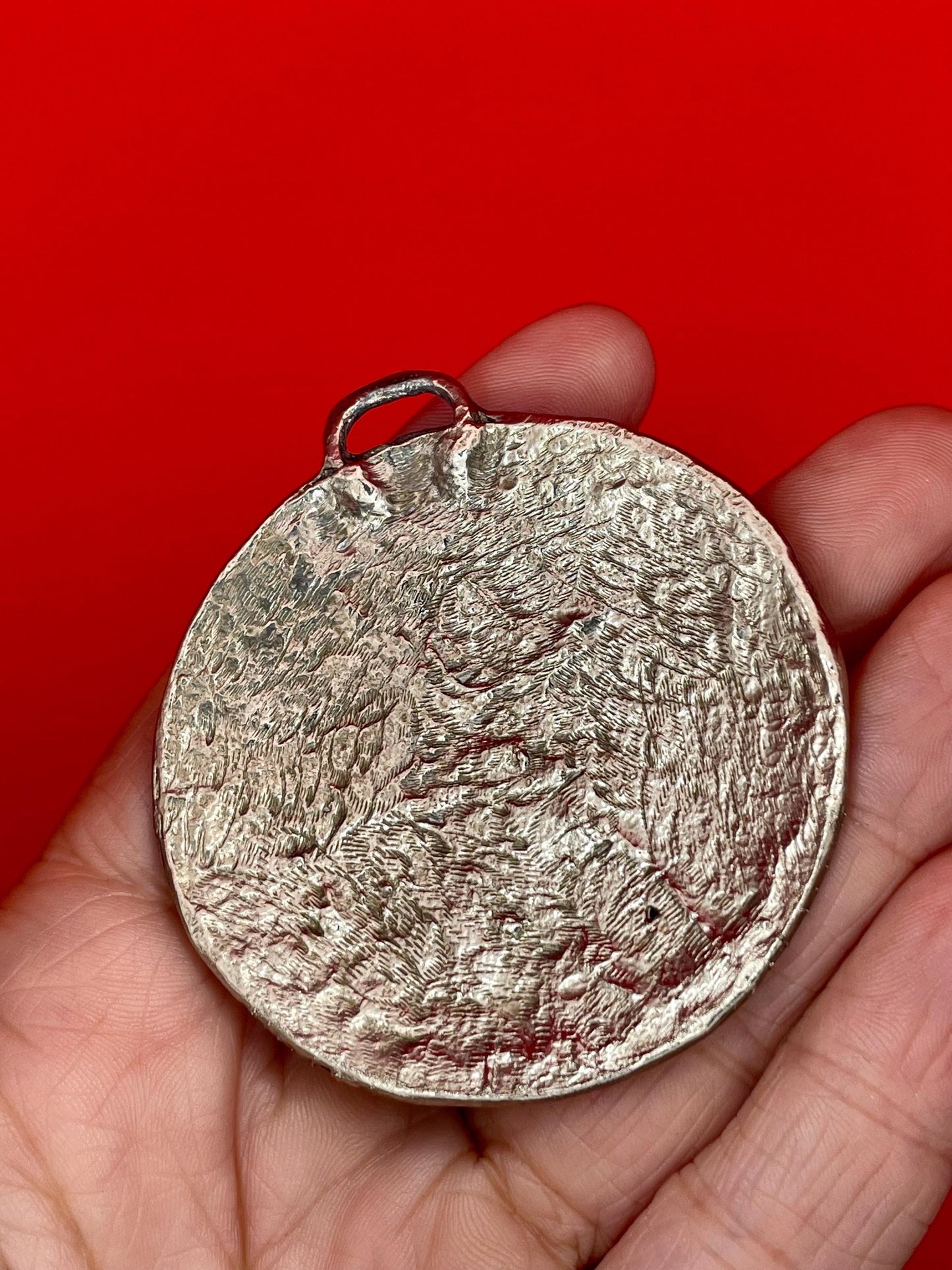 Round Hammered Metal Pendant with blue beads and Scroll Design