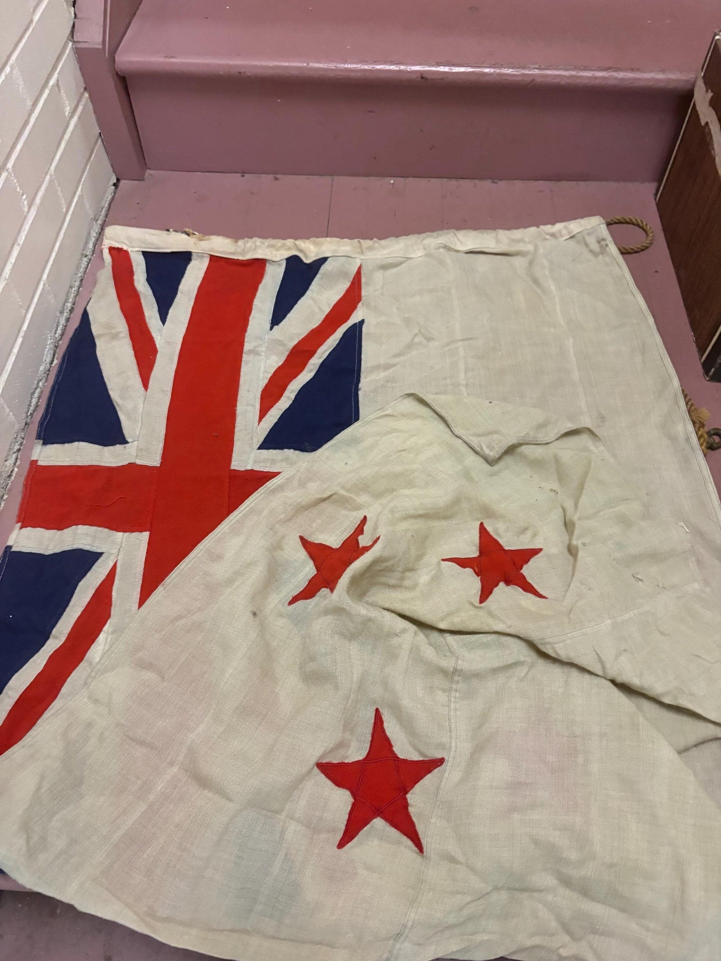 Stunning antique approximately 62 x 30 inch New Zealand flag with hardware  pretty good condition but see photos  great value
