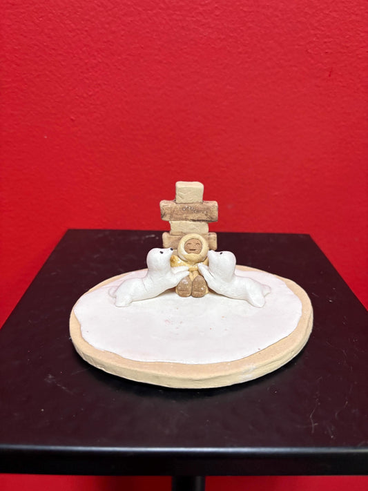 Beautiful indigenous statue of an Eskimo and seals and an Inukshuk  5 x 2 1/2“ high signed  2 available