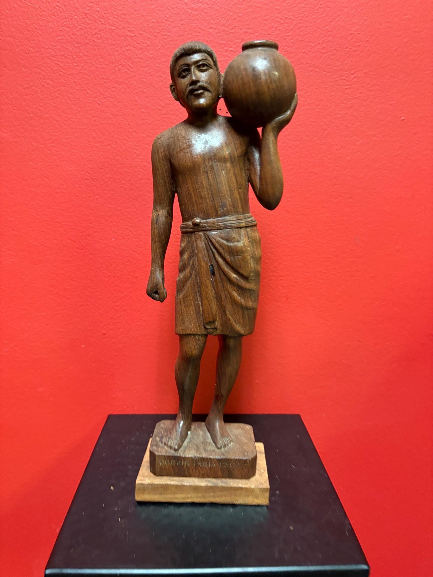 Beautiful wooden signed 1963 Indian statue of a man holding a pot  great detail and fabulous imagery