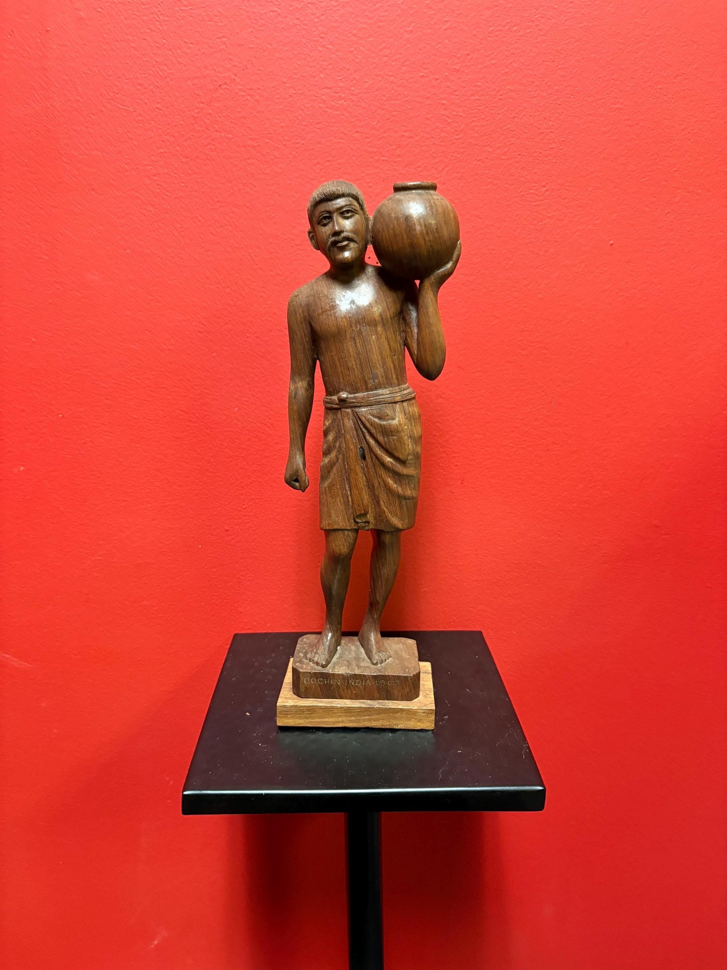 Beautiful wooden signed 1963 Indian statue of a man holding a pot  great detail and fabulous imagery