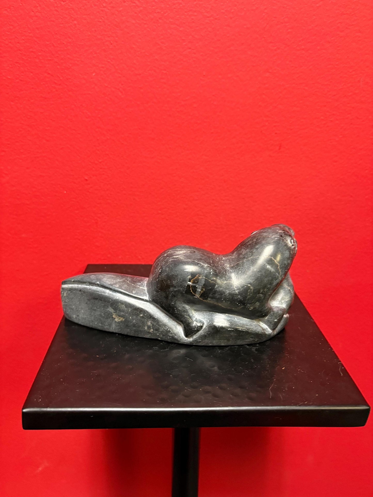 Beautiful old soapstone seal on log with fish in Mouth   7 inches long signed in good condition indigenous Inuit