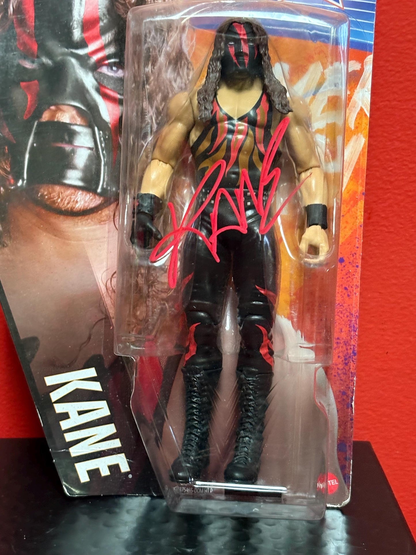 Signed WWE action figure in original packet  Kane   great gift and value - with CAO on back