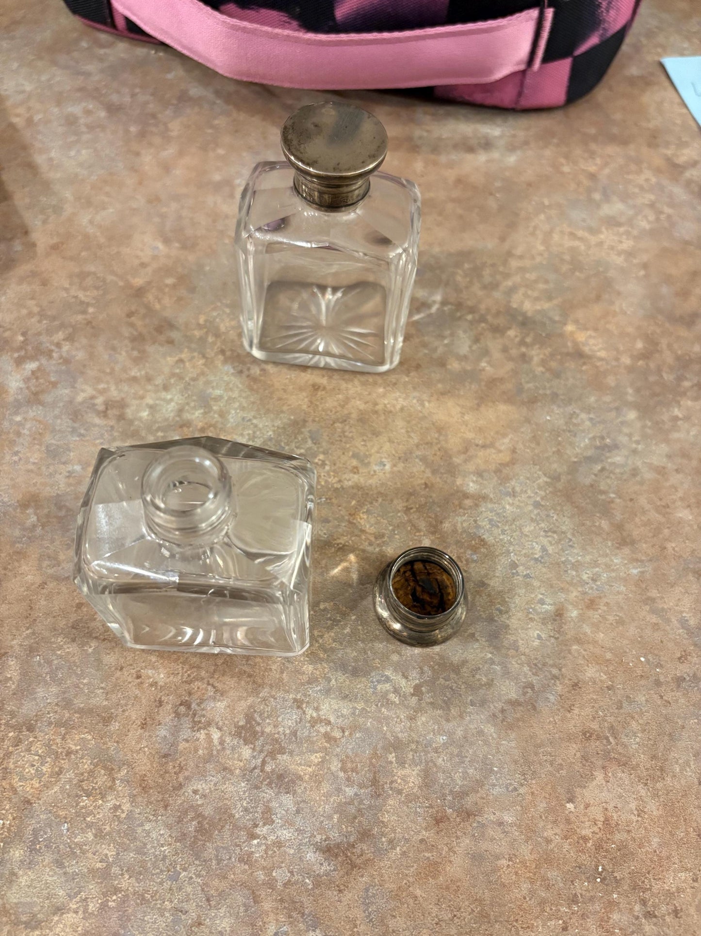 Pair English antique half inch tall untested silver top crystal bottles