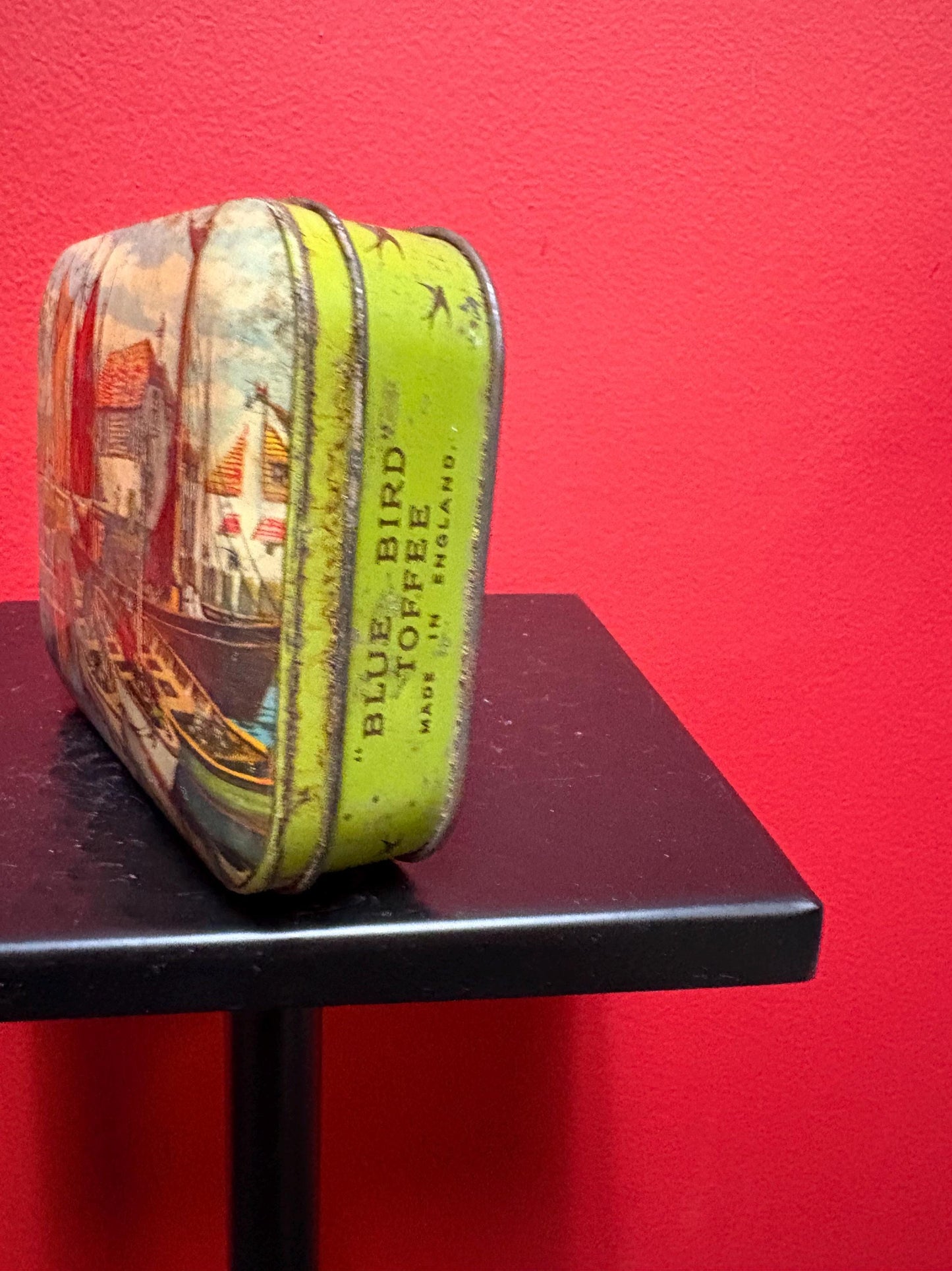 Lovely 5 1/2 x 4 x 1.25 high antique toffee tin with boats scene  old used condition