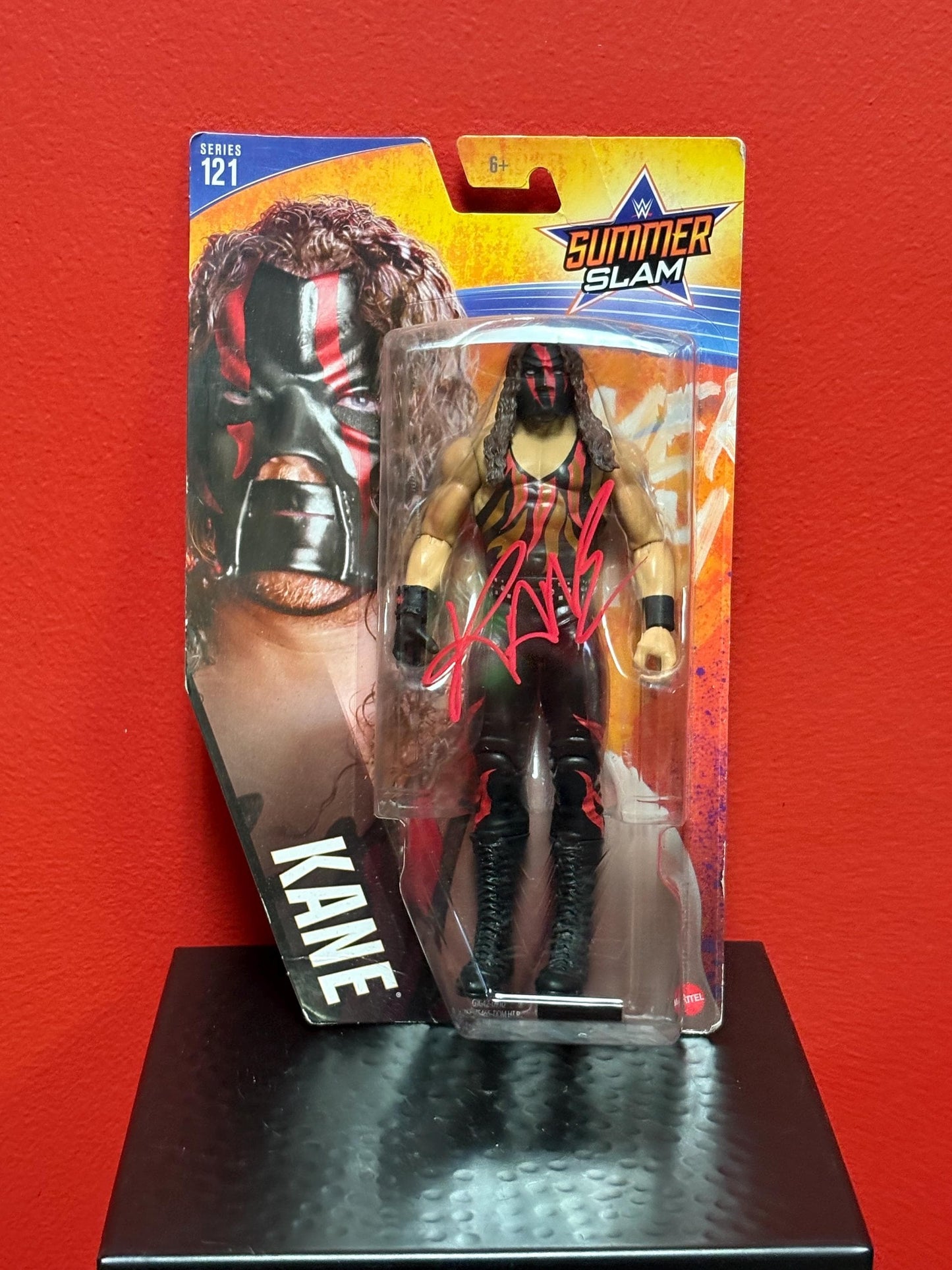 Signed WWE action figure in original packet  Kane   great gift and value - with CAO on back