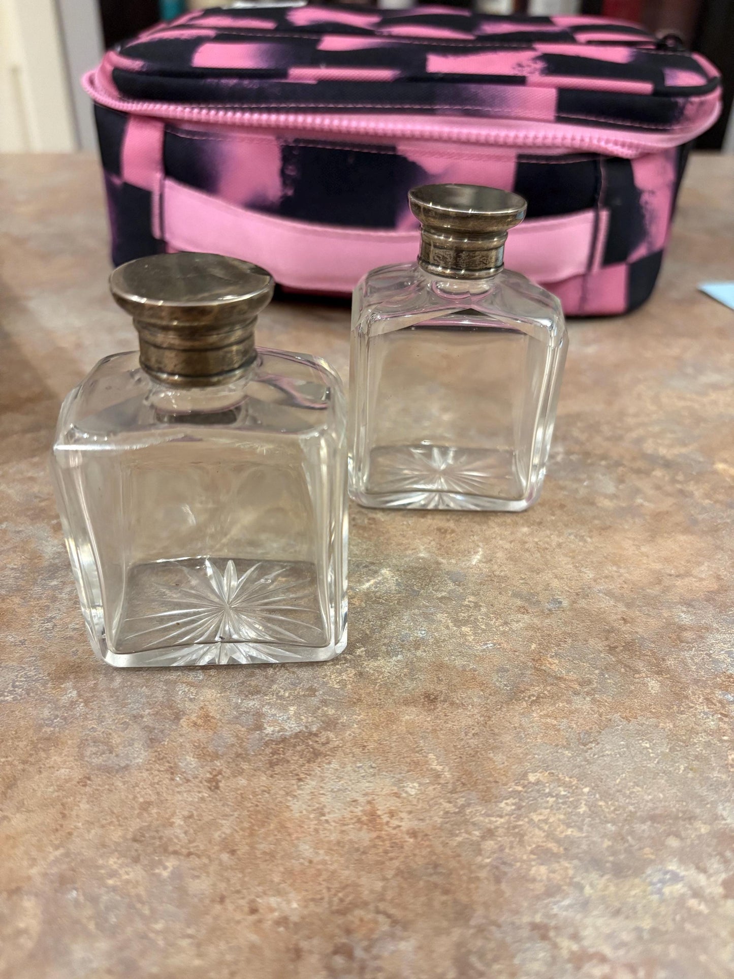 Pair English antique half inch tall untested silver top crystal bottles