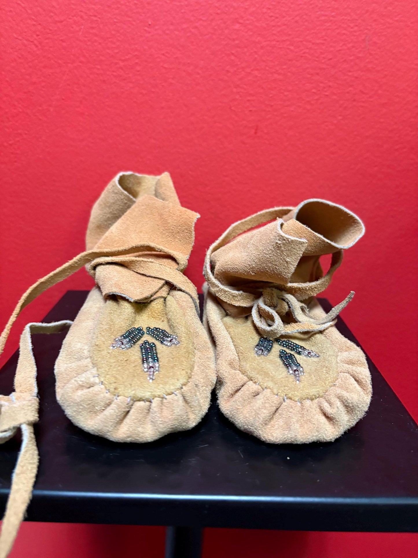 7 inch long indigenous leather and beaded  moccasins - good condition