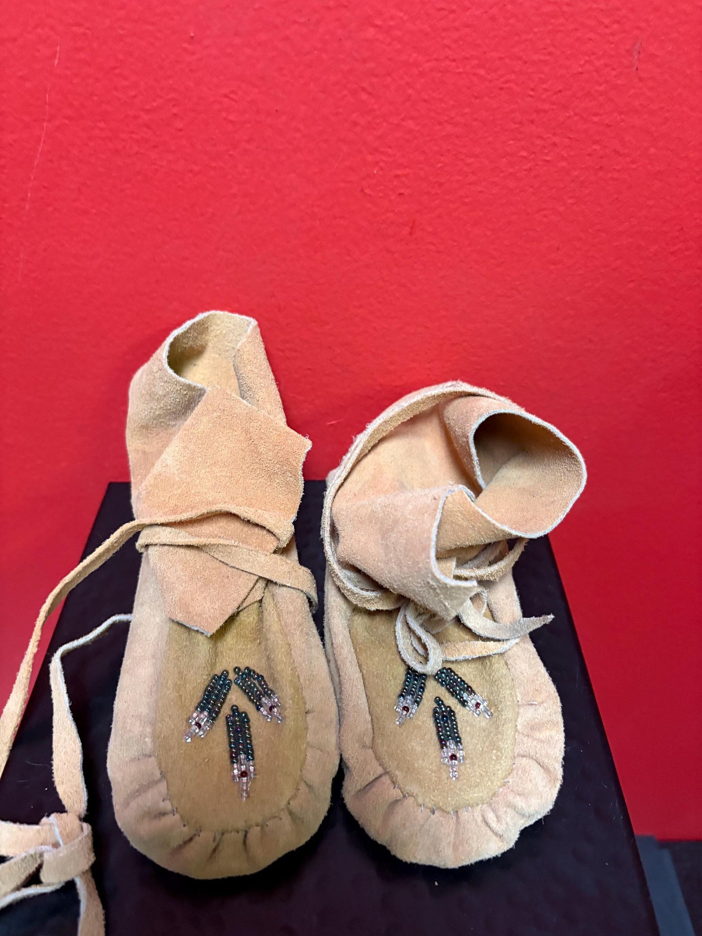 7 inch long indigenous leather and beaded  moccasins - good condition