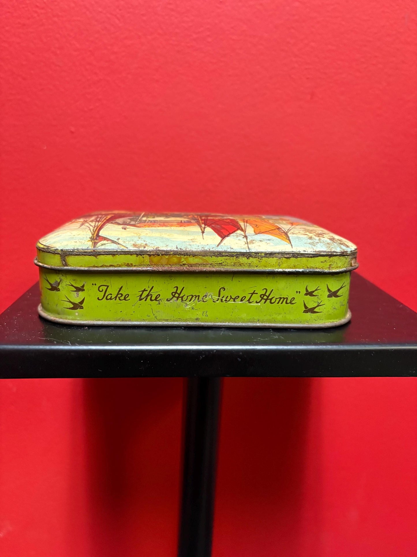 Lovely 5 1/2 x 4 x 1.25 high antique toffee tin with boats scene  old used condition