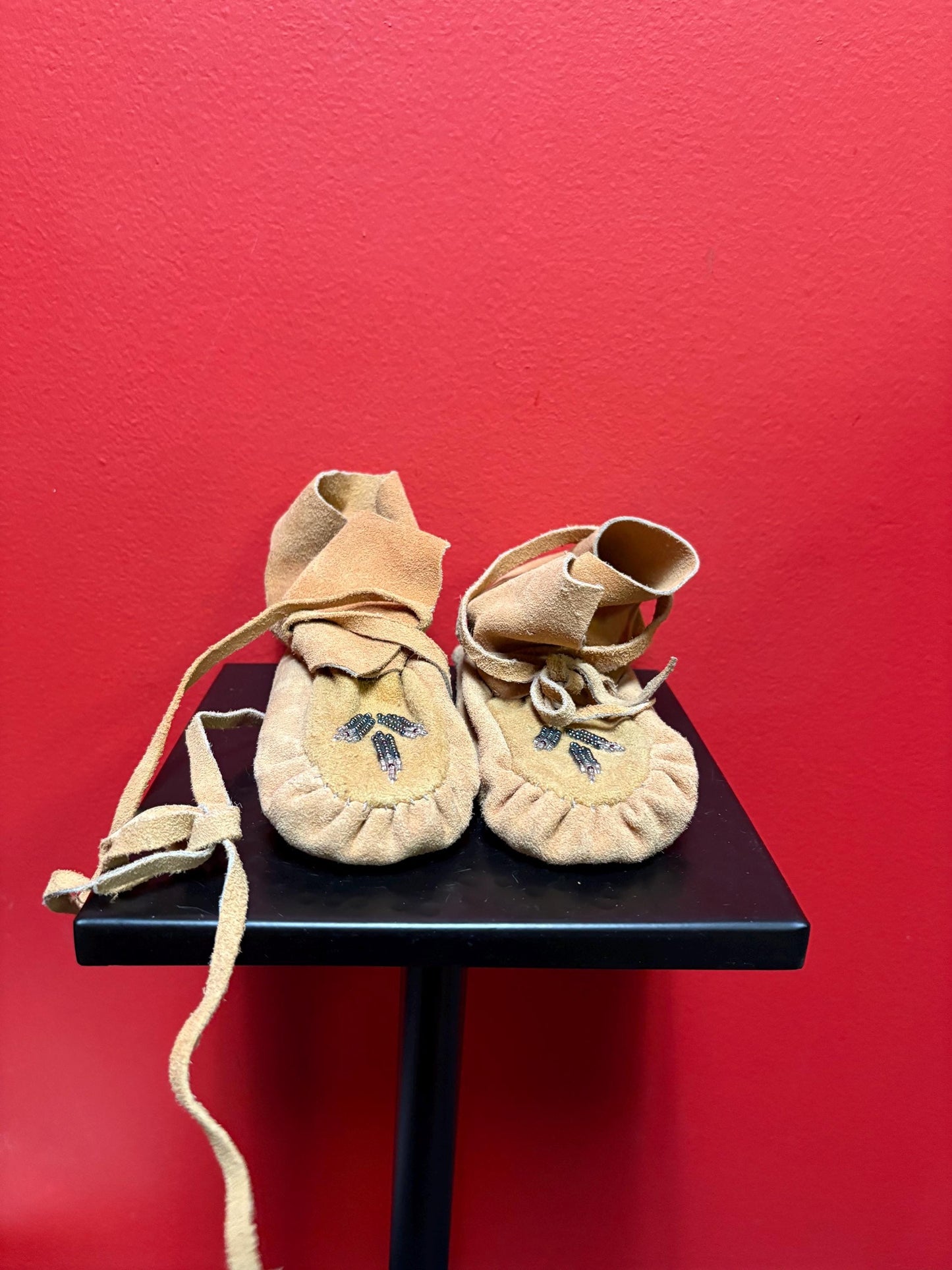 7 inch long indigenous leather and beaded  moccasins - good condition